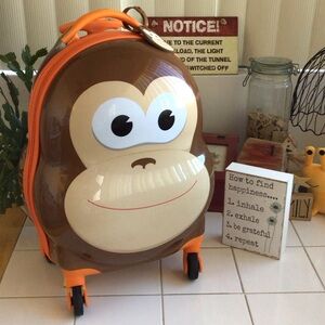‘Kirkland Signature’ Hardshell Monkey Face Spinner Luggage